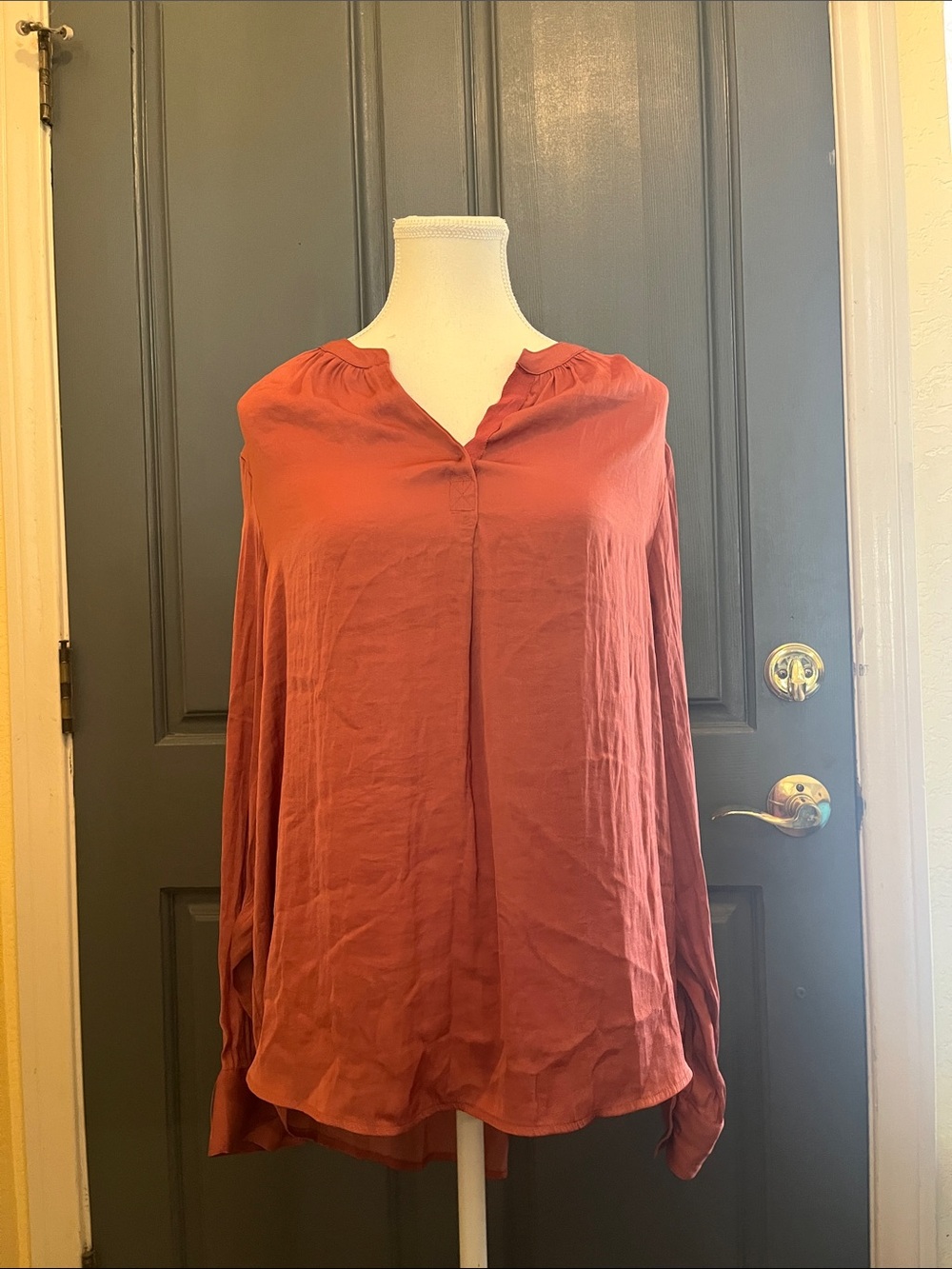 v-neck salmon-colored blouse